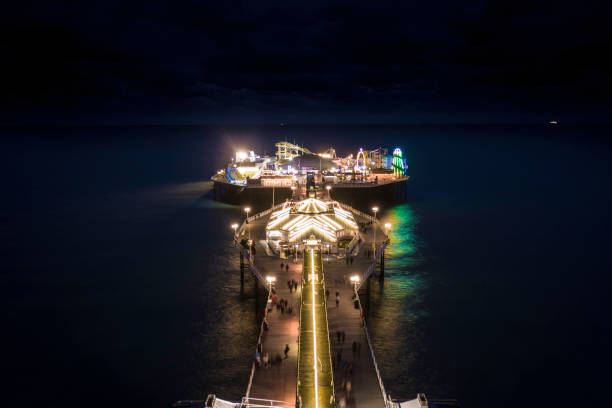 istock Brighton Palace Pier Illuminated at Night Looking South Aerial View 1192745752