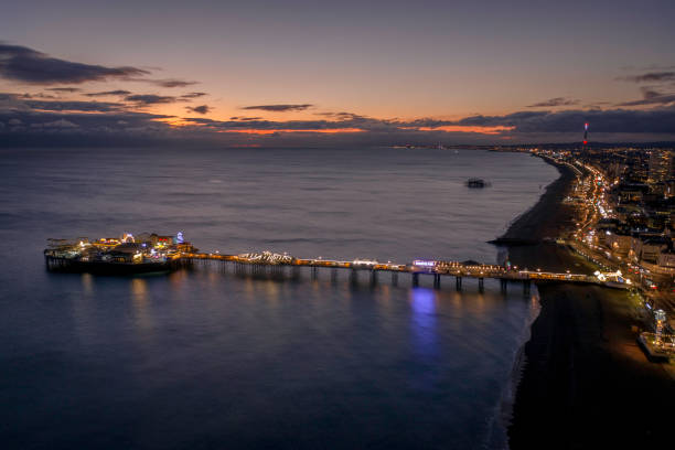 blue hour over brighton's palace pier and west pier aerial view - somerset west imagens e fotografias de stock