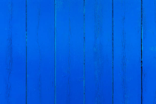 istock Freshly blue painted wood panels on house wall. 1192745903