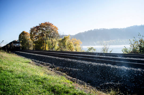 Train On Tracks By Pennsylvania River In Autumn Fall