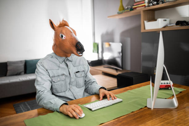 business-man-with-horse-mask-working-at-home-office.jpg