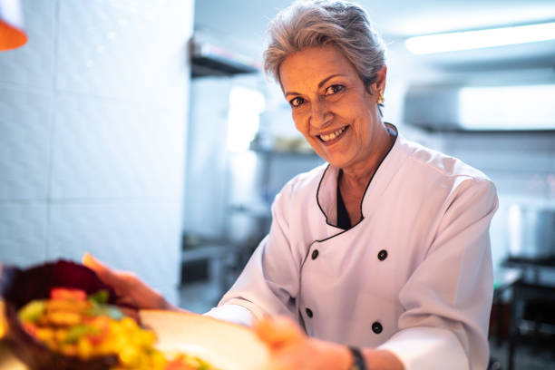 istock Portrait of chef showing his ready dish 1192758274