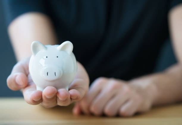 Piggy Bank In Front On Blackboard. The font is free for commercial use