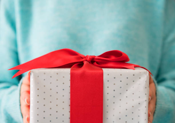 Woman hand holding gift package