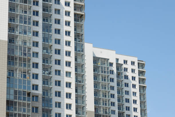 istock Modern high-rise apartment building at blue sky background 1192759929