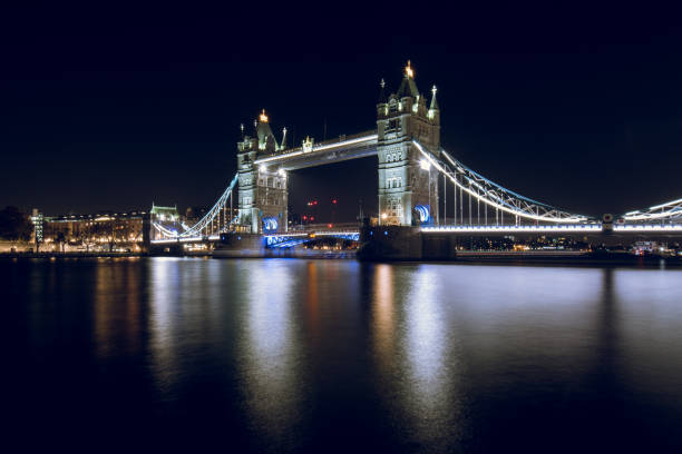Tower Bridge Illuminated at Night in the City of London, UK.