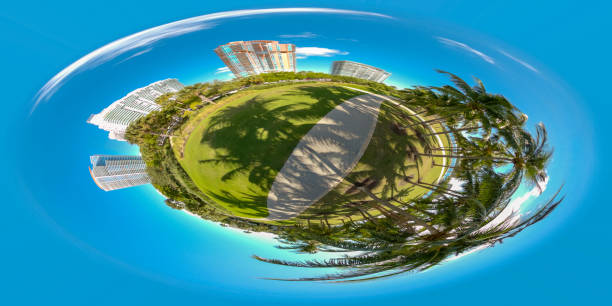 istock Tiny planet Miami Beach park scene palm trees and buildings 1192760447