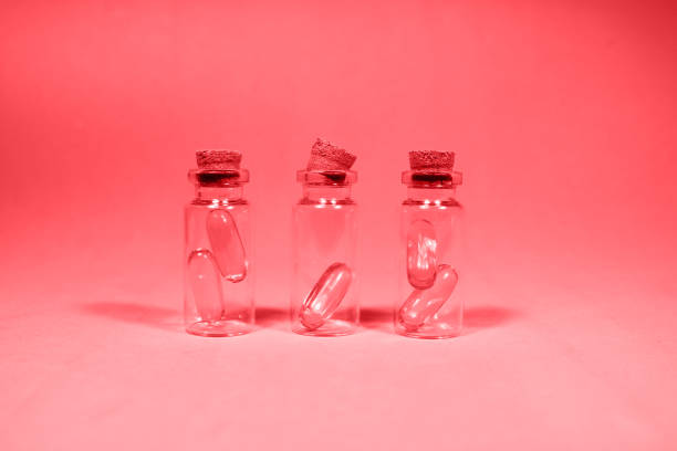 istock Three glass jars with omega 3 capsules 1192760732