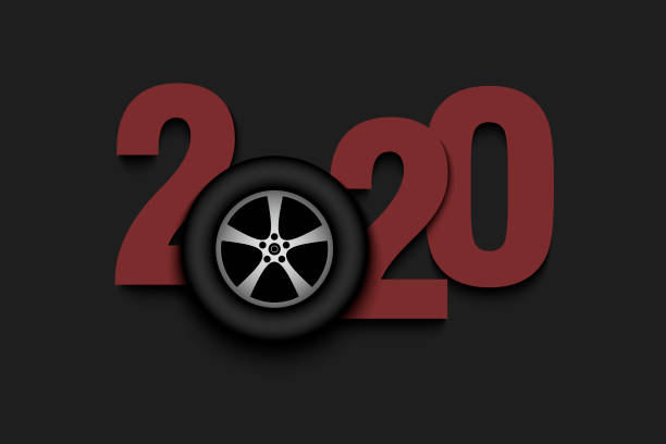 istock New Year numbers 2020 and car wheel 1192761328