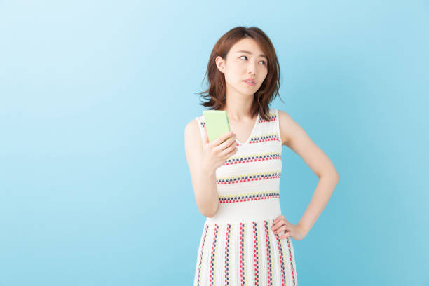 istock asian woman to see a smart phone,think, 1192765786