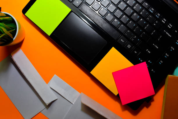 istock Close up Post card and laptop isolated on office desk background 1192767306