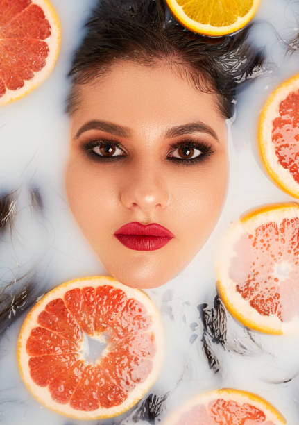 istock Fashion model with glam makeup in a fresh setting 1192769323