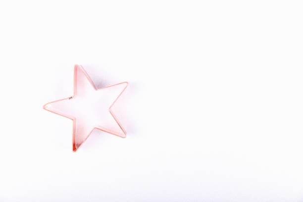 istock Flatlay with star copper cookie cutter on white sparkling background. Holiday, Christmas and New Year concept. Cozy homey details 1192776049