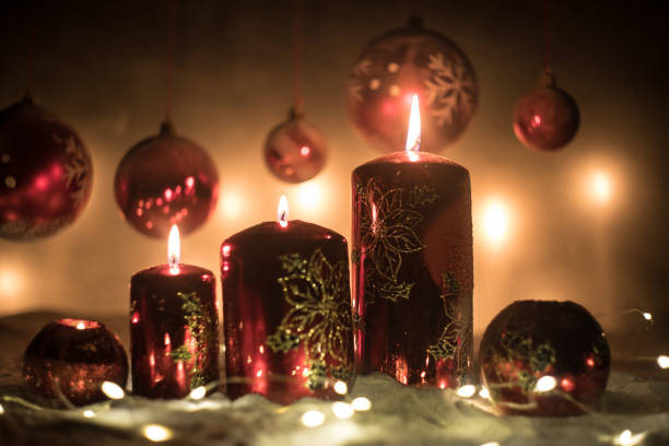 istock Creative artwork decoration. Christmas decoration with burning candles on a dark background. Christmas ornaments over dark golden background with lights. 1192779669