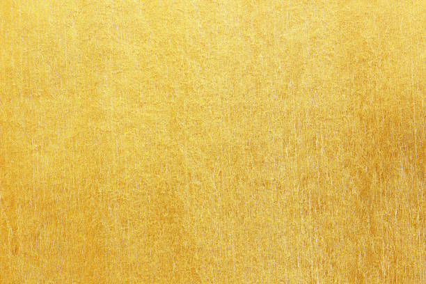 istock Shiny yellow leaf gold foil texture background 1192781423