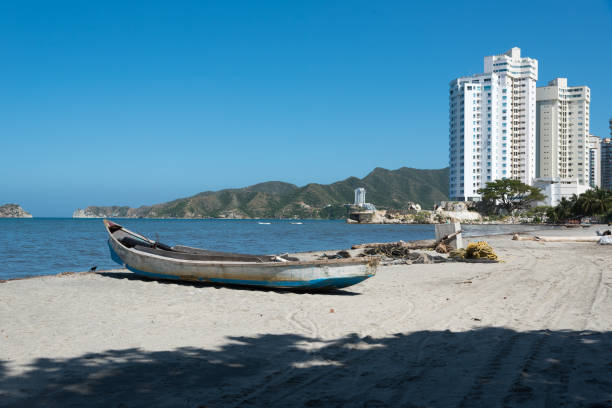 fishing boat on the beach in the city of Santa Marta. Colombia.