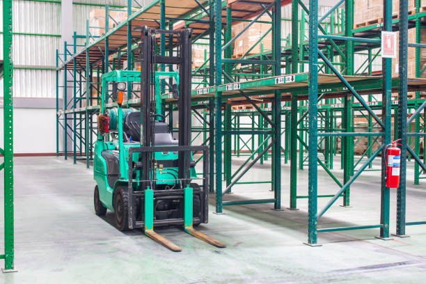 istock Forklifts with rack and shelf inside warehouse 1192800137