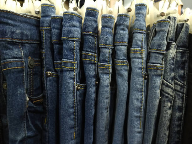istock many models of jeans from different denim, texture, color hang on hangers 1192809718
