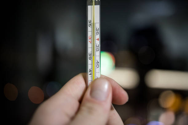 istock high temperature on the thermometer in hand 1192812788