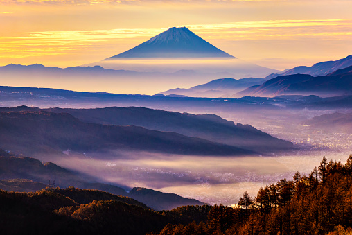 Fuji Mountain with Morning Mist at Takabocchi HIghlands in Autumn, Nagano, Japan