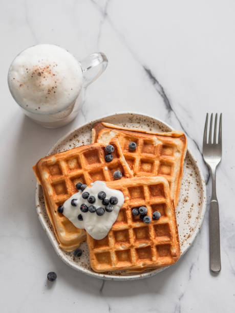 istock Breakfast belgian waffles, cappuccino. Copy space 1192818443