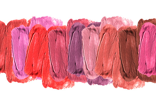 Palette of colorful mat lipstick swatches on white background