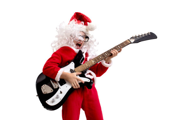 istock Boy dressed as Santa Claus with a guitar on a white background 1192819869