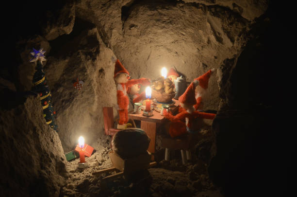 Pixie gang eating a Christmas meal in an underground den, only with light from the candles.