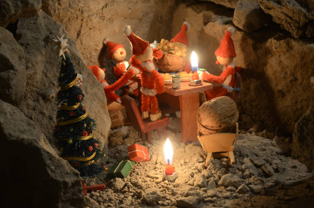 Pixie gang eating a Christmas meal in an underground den, only with light from the candles.