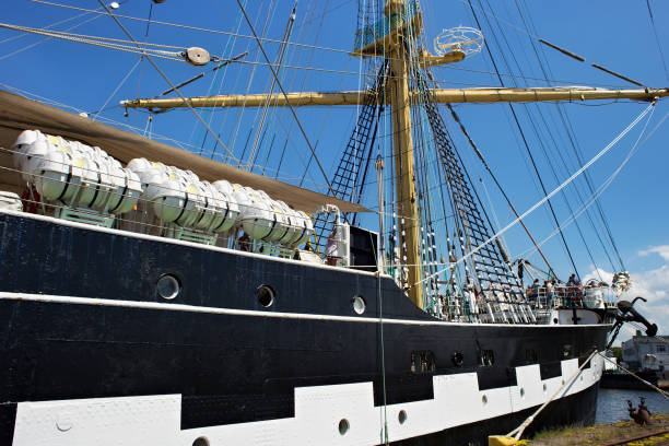 View of the historical barque Kruzenshtern (prior Padua) moored in the Kaliningrad Sea Port. The ship launched in 1926 and was surrendered to the USSR in 1946. KALININGRAD, RUSSIA - JUNE 19, 2016: View of the historical barque Kruzenshtern (prior Padua) moored in the Kaliningrad Sea Port. The ship launched in 1926 and was surrendered to the USSR in 1946. krusenstern stock pictures, royalty-free photos & images