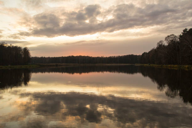 istock Sun setting behind a lake in central Poland. 1192821860