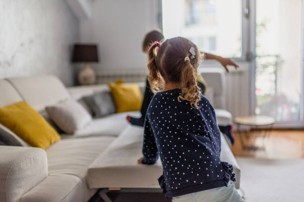istock Kids playing in living room 1192821921