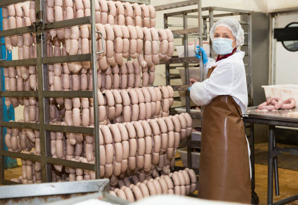 istock Workwoman carrying sausage trolley 1192825733