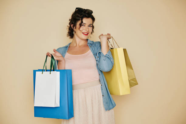 istock Happy female shopaholic 1192826127