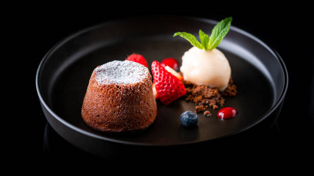Lava cake Molten chocolate cake aka Lava cake. Served with a scoop of sorbet ice pie photography stock pictures, royalty-free photos & images