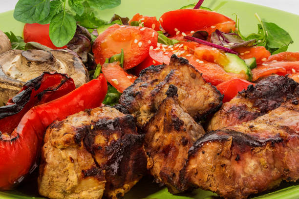 istock Grilled meat with vegetable on a plate 1192830862