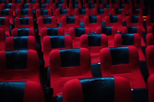 istock Cinema theater hall inside, red chairs. Empty cinema hall 1192833362