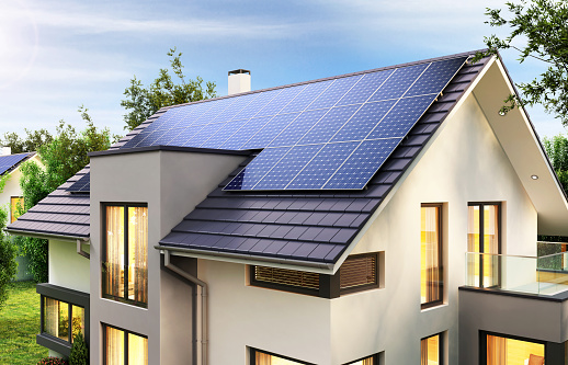 Paneles solares en el techo de la casa moderna photo
