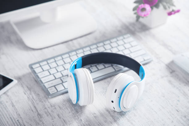 istock White headphones with a computer. Business desk 1192834380
