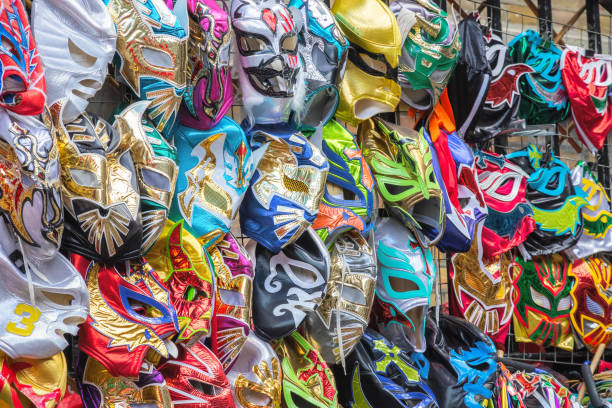 Wrestling masks at a street stall of Brick Lane Market in London A selection of wrestling masks displayed at a street stall of Brick Lane Market in London wrestlers uniform stock pictures, royalty-free photos & images