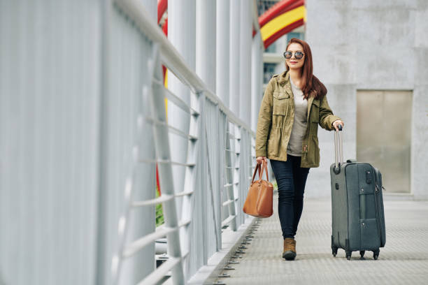 istock Woman walking to rail station 1192836307