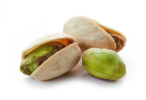 pistachio nuts macro isolated on white background