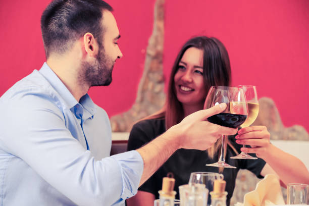 istock Happy couple toasting with wine. 1192837727