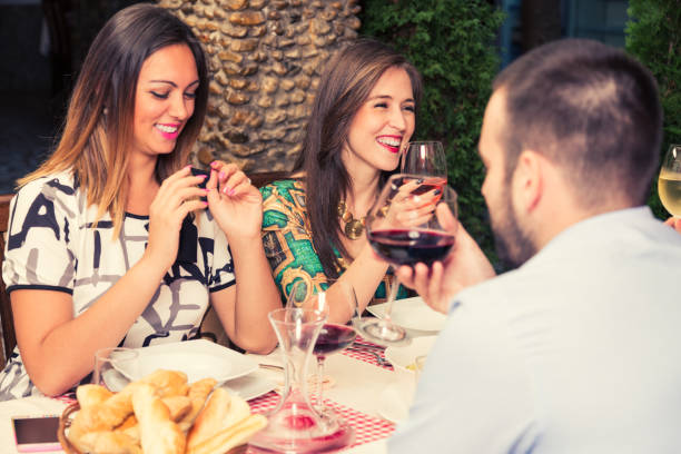 istock Happy friends talking while having lunch together. 1192837762
