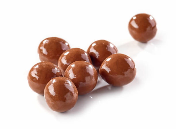 brown chocolate balls isolated on white background