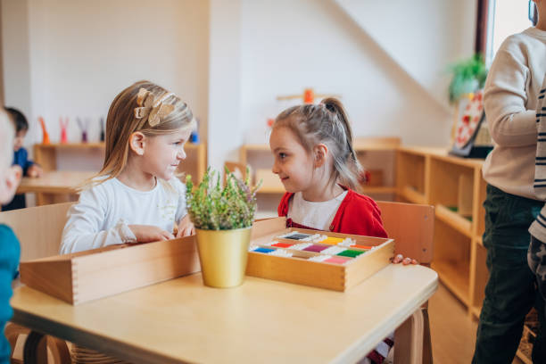 istock Girls playing in preschool classroom 1192838984