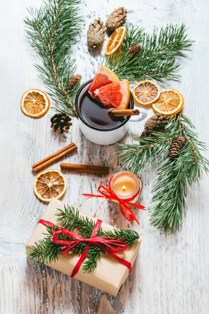 Mulled wine on gray wooden background.