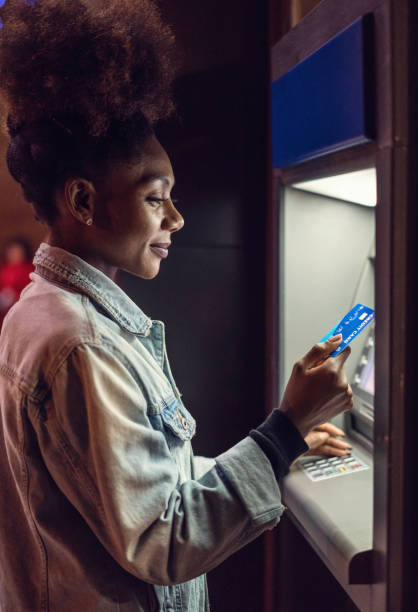 istock Woman at the ATM device 1192840148
