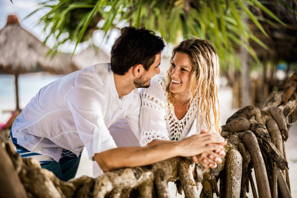 istock Young happy couple talking during summer day in nature. 1192840345