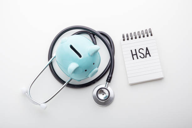 istock HSA word on note pad with piggy bank and stethoscope 1192840619